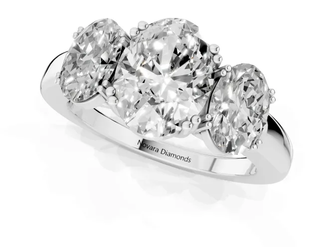 Oval Cut Diamond Three-Stone Ring Set in Platinum with Polished Band and Prong Setting – second view