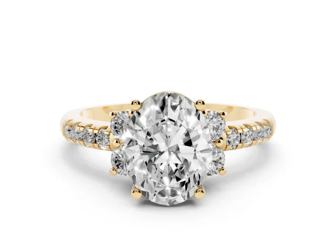 Oval Cut Diamond Three-Stone Pavé Ring Set in Yellow gold with Prong Setting