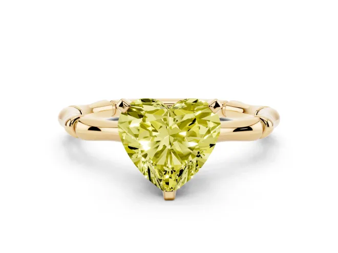 Fancy Yellow Heart Cut Diamond Solitaire Ring Set in Yellow gold with Bamboo Band and Prong Setting