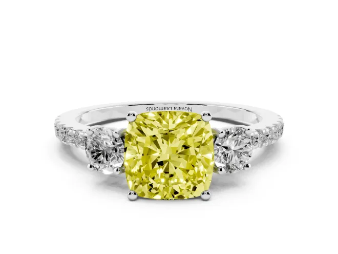 Fancy Yellow Cushion Cut Diamond Three-Stone Ring Set in White gold with Pavé Band and Graduated Sides