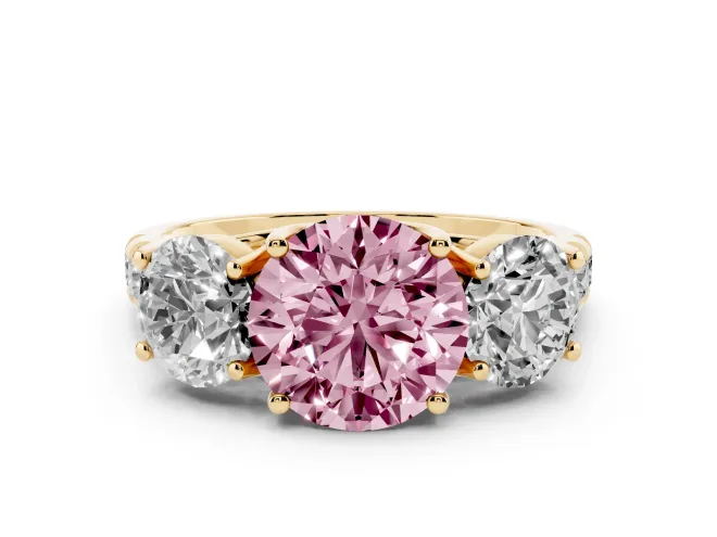 Fancy Pink Round Cut Diamond Three-Stone Ring Set in Yellow gold with Pavé Band