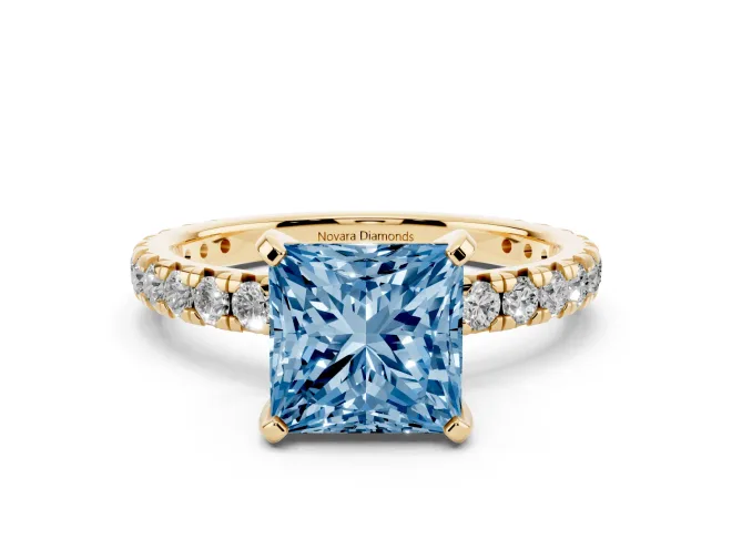 Fancy Blue Princess Cut Diamond Pavé Solitaire Ring Set in Yellow gold with Round Band and Prong Setting