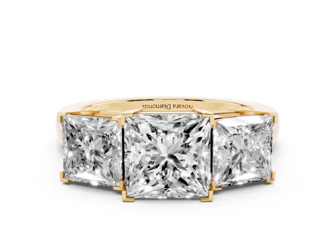 Princess Cut Diamond Three-Stone Ring Set in Yellow gold with Channel-Set Band and Prong Settings