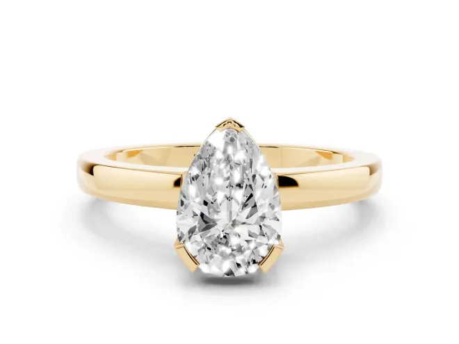 Pear Cut Diamond Solitaire Ring Set in Yellow gold with Prong Head and Smooth Polished Band