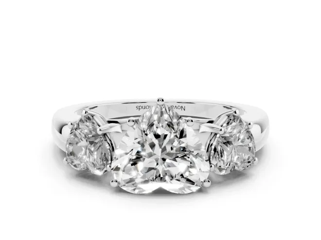 Heart Cut Diamond Three-Stone Ring Set in White gold with Bold Center and Classic Band