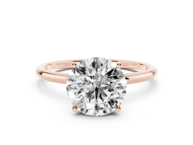 Round Cut Diamond Solitaire Engagement Ring Set in Rose gold with Thin Band and Prong Setting