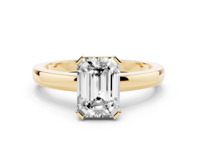 Emerald Cut Diamond Solitaire Ring Set in Yellow gold with Prong Head and Smooth Polished Band