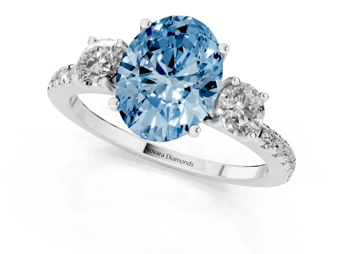 Fancy Blue Oval Cut Diamond Three-Stone Ring Set in Silver with Pavé Band and Graduated Sides – second view