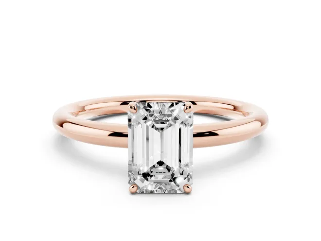 Emerald Cut Diamond Solitaire Ring Set in Rose gold with Prong Setting on a Polished Plain Band