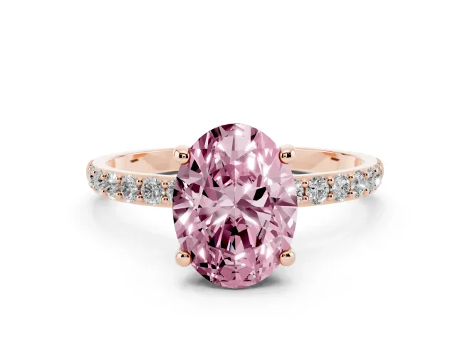 Fancy Pink Oval Cut Diamond Solitaire Ring Set in Rose gold with Round Pavé Band and Prong Setting