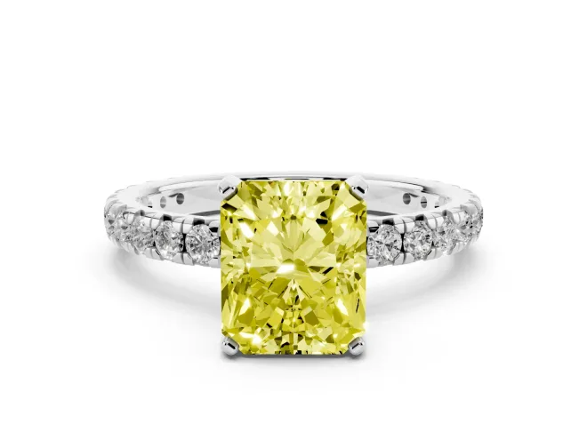Fancy Yellow Radiant Cut Diamond Pavé Solitaire Ring Set in White gold with Round Band and Prong Setting