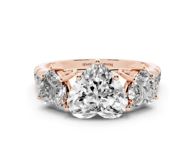 Heart Cut Diamond Three-Stone Ring Set in Rose gold with Pavé Band
