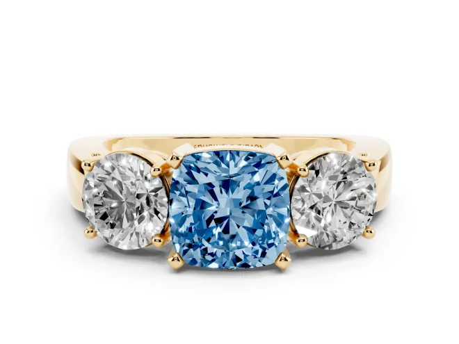 Fancy Blue Cushion Cut Diamond Three-Stone Ring Set in Yellow gold with Round Side Stones and Classic Band