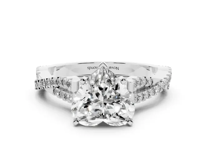 Heart Cut Diamond Solitaire Engagement Ring Set in White gold with Twisted Pavé Band and Prong Setting