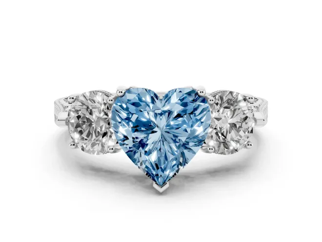 Fancy Blue Heart Cut Diamond Three-Stone Ring Set in White gold with Milgrain Band