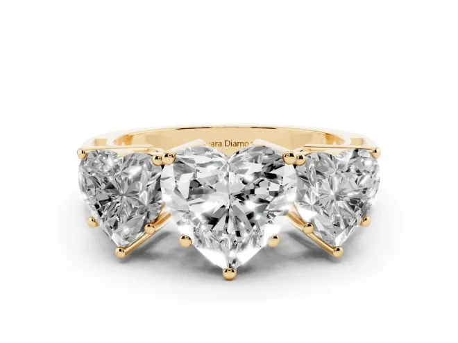 Heart Cut Diamond Three-Stone Ring Set in Yellow gold with Textured Band
