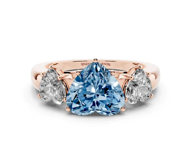 Heart-Shaped Three Stone Engagement Ring Setting for a Fancy Blue Lab-Grown Diamond | Matching Side Stones | Rose Gold