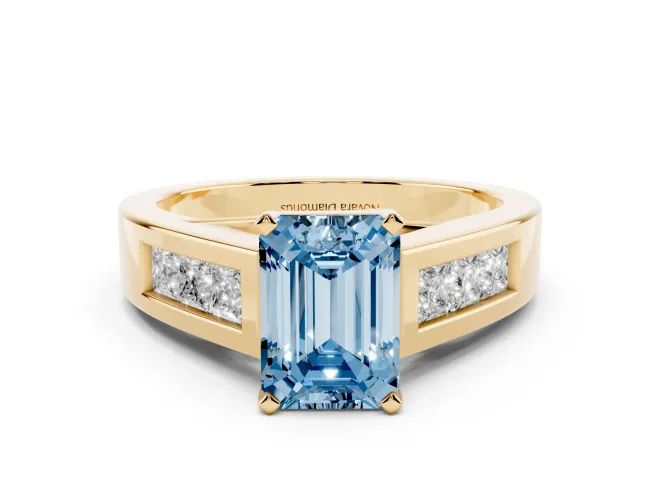 Fancy Blue Emerald Cut Diamond Solitaire Ring Set in Yellow gold with Channel-Set Accent Stones and Prong Setting