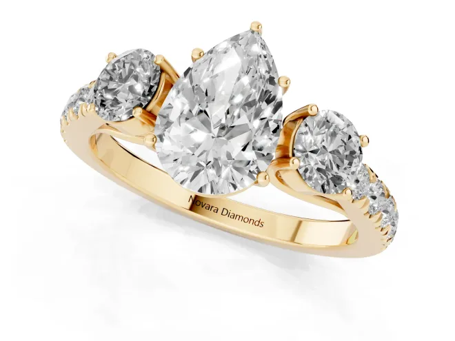 Pear Cut Diamond Three-Stone Ring Set in Yellow gold with Round Side Stones and Delicate Pavé Band – second view