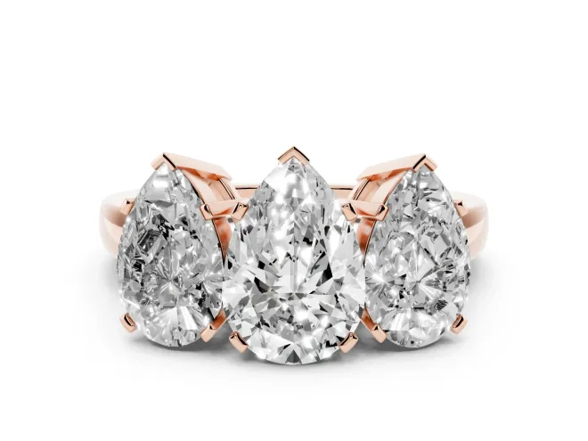 Pear Cut Diamond Three-Stone Ring Set in Rose gold with Channel-Set Band and Prong Settings