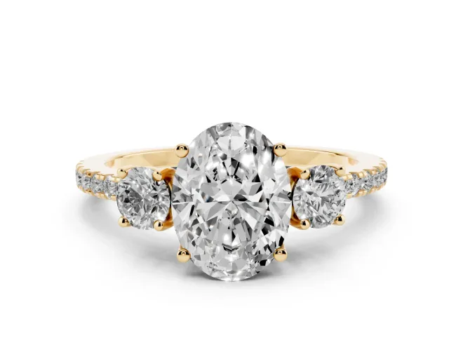 Oval Cut Diamond Three-Stone Ring Set in Yellow gold with Pavé Band and Graduated Sides