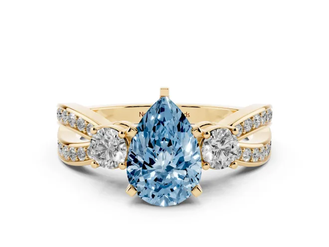 Pear-Shaped Three-Stone Twist Engagement Ring Setting for a Fancy Blue Lab-Grown Diamond | Yellow Gold
