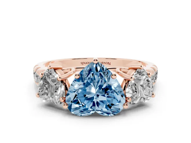 Fancy Blue Heart Cut Diamond Three-Stone Ring Set in Rose gold with Pavé Band
