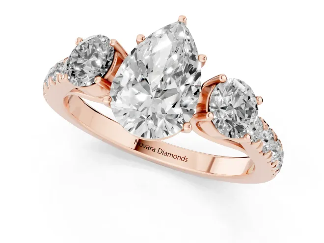 Pear Cut Diamond Three-Stone Ring Set in Rose gold with Round Side Stones and Delicate Pavé Band – second view
