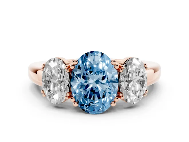 Fancy Blue Oval Cut Diamond Three-Stone Ring Set in Rose gold with Polished Band and Prong Setting