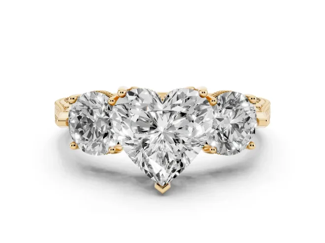 Heart Cut Diamond Three-Stone Ring Set in Yellow gold with Milgrain Band