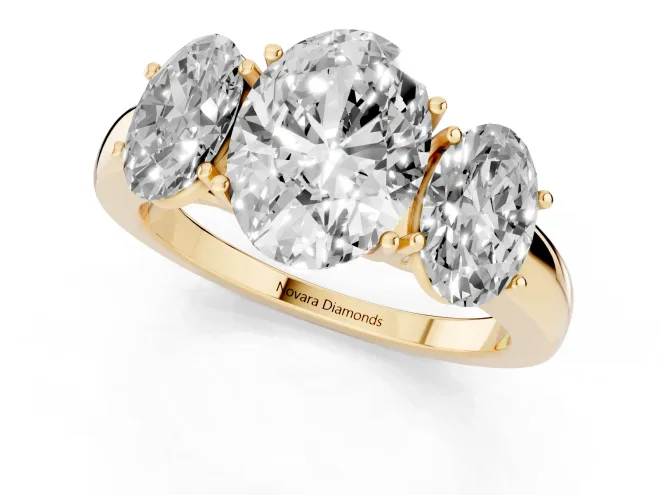 Oval Cut Diamond Three-Stone Ring Set in Yellow gold with Bold Center and Classic Band – second view