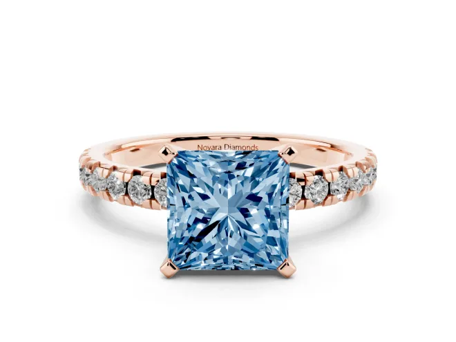 Fancy Blue Princess Cut Diamond Solitaire Pavé Engagement Ring Set in Rose gold with Round Band and Prong Setting