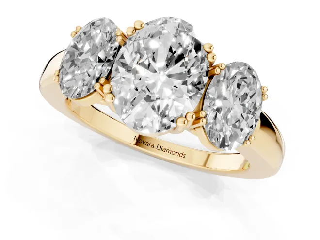 Oval Cut Diamond Three-Stone Ring Set in Yellow gold with Polished Band and Prong Setting – second view
