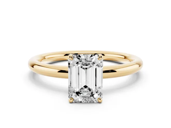 Emerald Cut Diamond Solitaire Ring Set in Yellow gold with Prong Setting on a Polished Plain Band