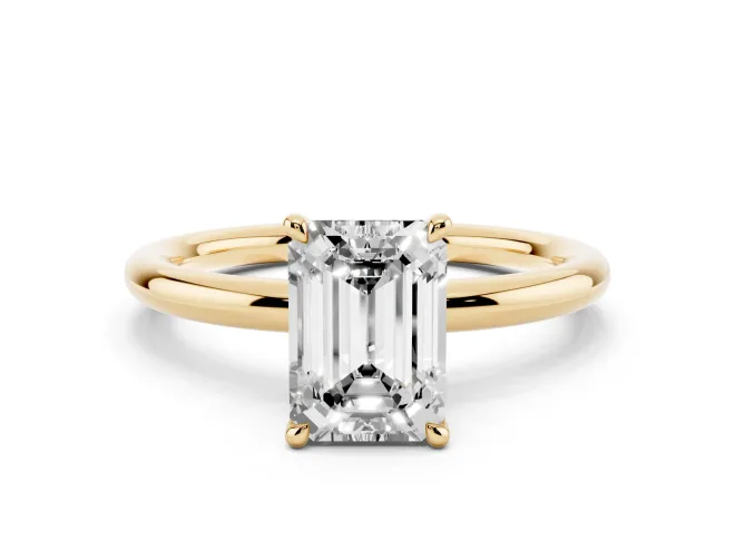 Emerald Cut Diamond Solitaire Ring Set in Yellow gold with Thin Band and Prong Setting