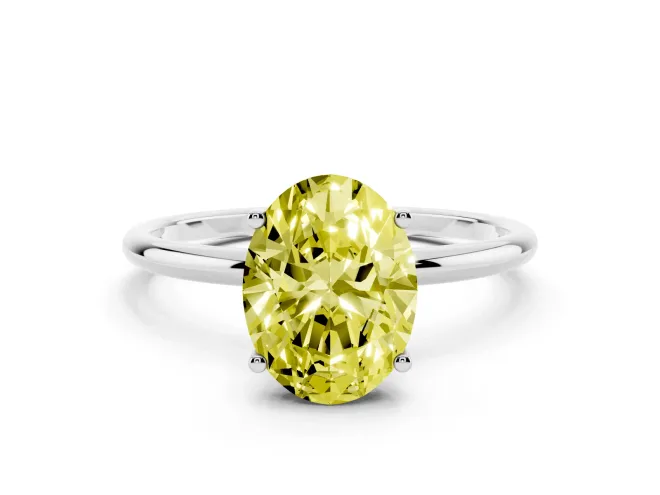 Fancy Yellow Oval Cut Diamond Solitaire Engagement Ring Set in Platinum with Thin Band and Prong Setting