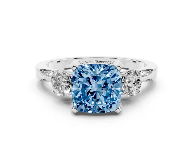 Fancy Blue Cushion Cut Diamond Three-Stone Ring Set in White gold with Pavé Band and Smaller Side Stones