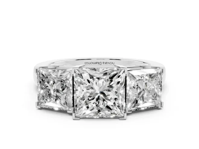 Princess Cut Diamond Three-Stone Ring Set in White gold with Channel-Set Band and Prong Settings