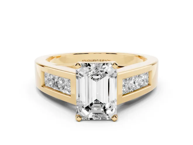 Emerald Cut Diamond Solitaire Ring Set in Yellow gold with Channel-Set Accent Stones and Prong Setting