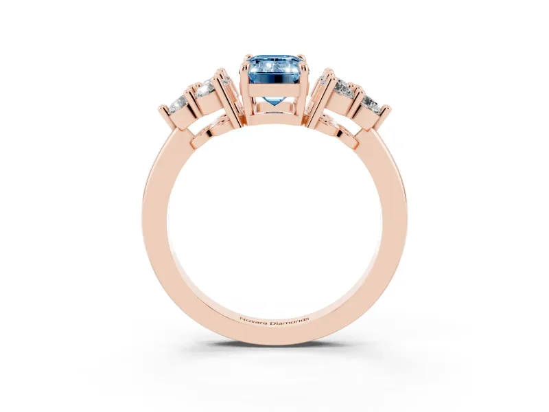 Fancy Blue Emerald Cut Diamond Solitaire Ring Set in Rose gold with Cluster Accents on Each Side
