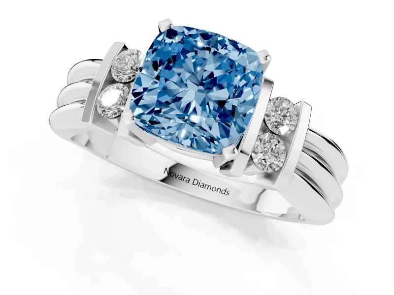 Fancy Blue Three-Stone Cushion Cut Diamond Channel Set Ring Set in Platinum with Bar Prongs