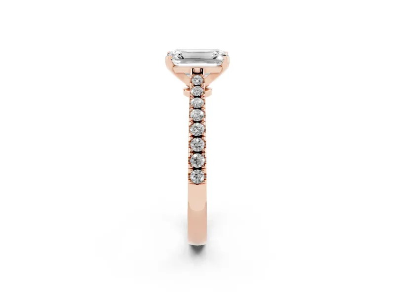 Emerald Cut Diamond Solitaire Engagement Ring Set in Rose gold with Delicate Pavé Band and Prong Setting