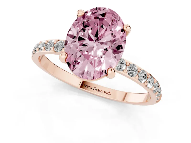 Fancy Pink Oval Cut Diamond Solitaire Ring Set in Rose gold with Round Pavé Band and Prong Setting