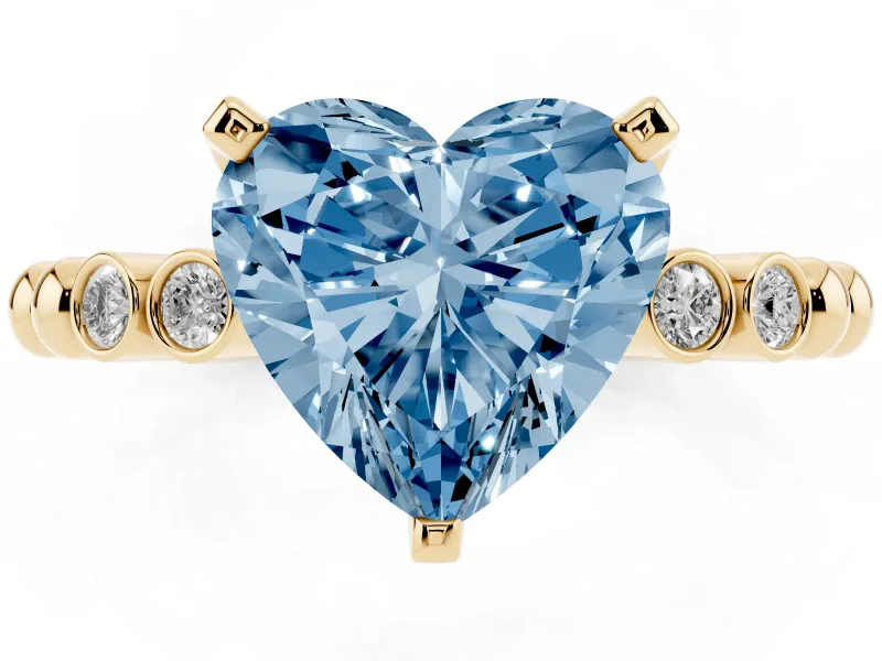 Fancy Blue Heart Cut Diamond Solitaire Engagement Ring Set in Yellow gold with Bezel Accents on Beaded Band