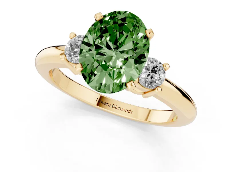 Fancy Green Three-Stone Oval Cut Diamond Ring Set in Yellow gold with Prong Setting and Plain Band