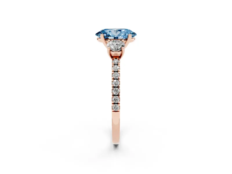 Fancy Blue Oval Cut Diamond Three-Stone Ring Set in Rose gold with Pavé Band and Graduated Sides
