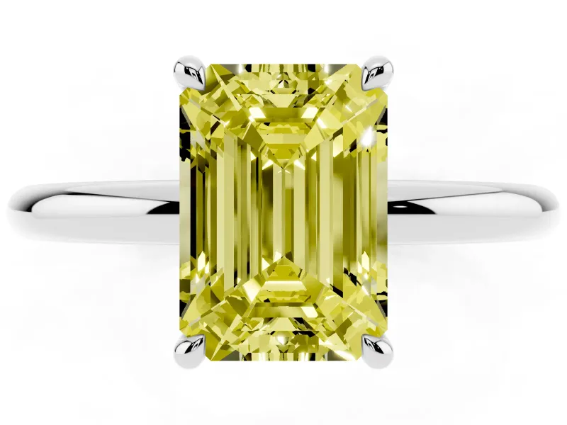 Fancy Yellow Emerald Cut Diamond Solitaire Ring Set in Silver with Thin Band and Prong Setting