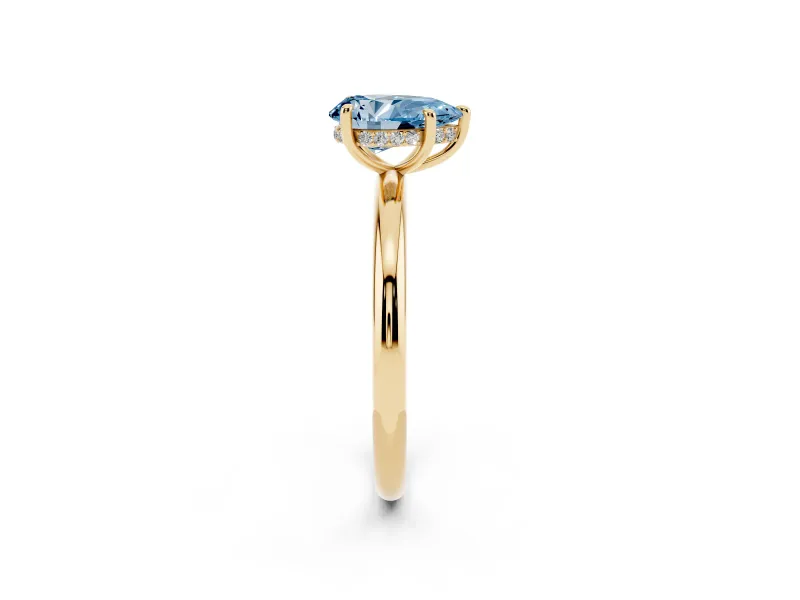 Fancy Blue Pear Cut Diamond Solitaire Ring Set in Yellow gold with Thin Band and Prong Setting
