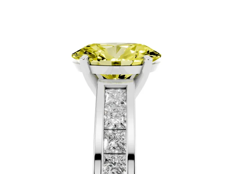 Fancy Yellow Oval Cut Diamond Solitaire Ring Set in White gold with Channel-Set Band and Prong Setting