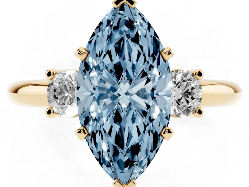 Fancy Blue Three-Stone Marquise Cut Diamond Ring Set in Yellow gold with Prong Setting and Plain Band